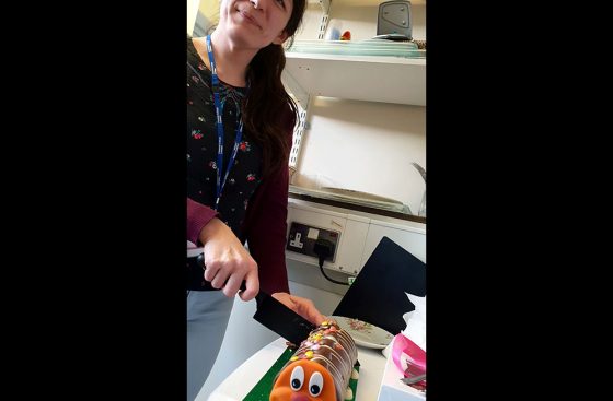 Sarah Faull's birthday celebrated in the office with Colin the Caterpillar roll cake